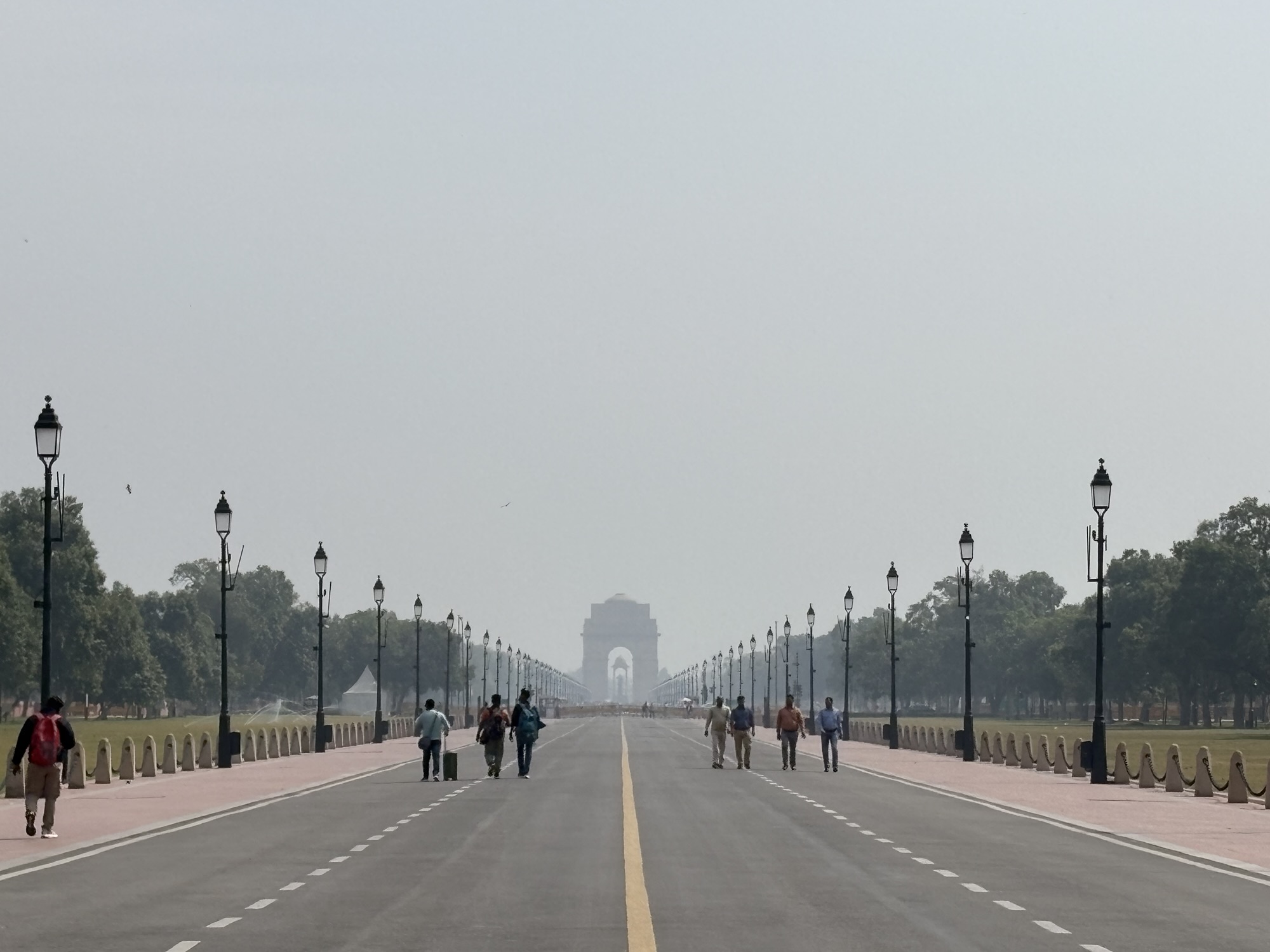 A view of India Gate, taken from far away on the Kartavya Path, a long tree-lined boulevard in New Delhi
