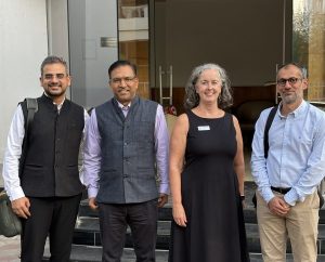 Mairead stands outside the ORF offices with Sagar Vishnoi, Niranjar Sahoo & Rahul Batra